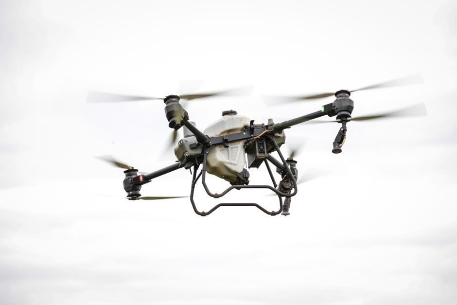 A drone flying over a geological site, collecting data for surveying purposes.